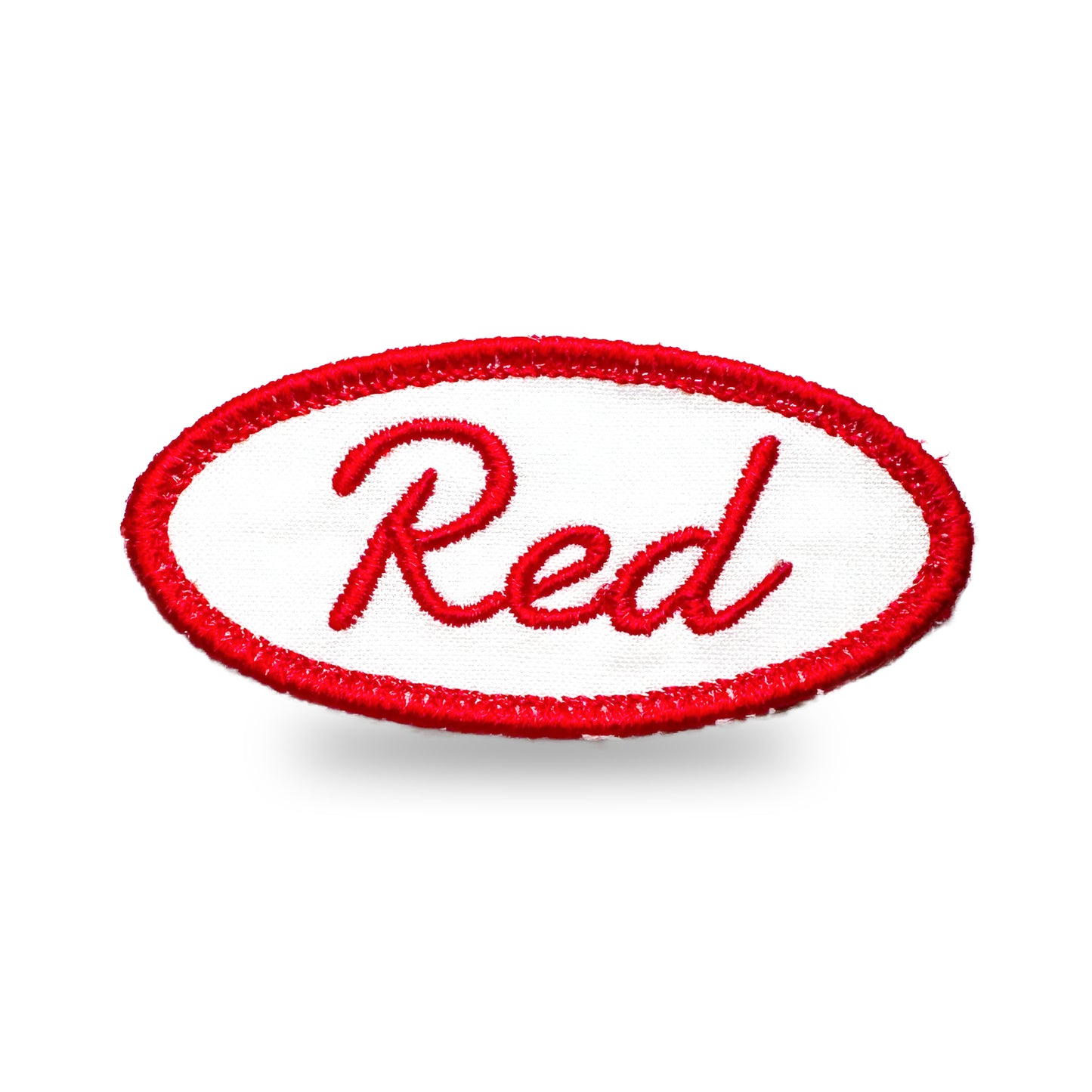 Red oval-shaped patch